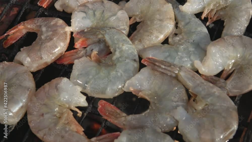 Top view panorama of the large raw shrimps roasting on the grill grid. Shrimp Recipe Top view panorama of the large raw shrimps roasting on the grill grid. Shrimp Recipe