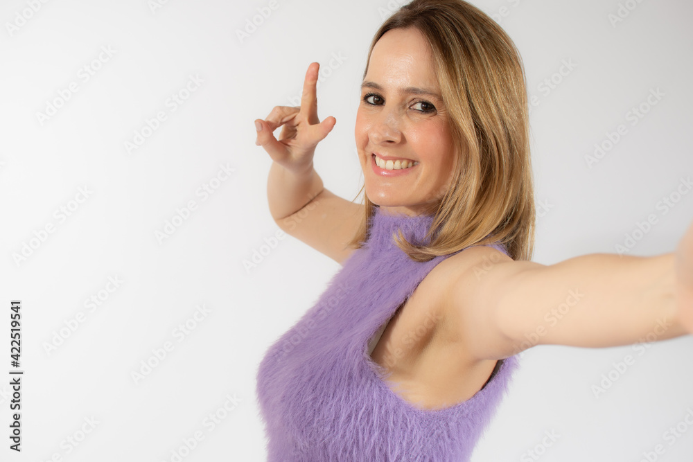 Close up portrait of young woman over isolated background smiling and showing victory sign Close up portrait of young woman over isolated background smiling and showing victory sign