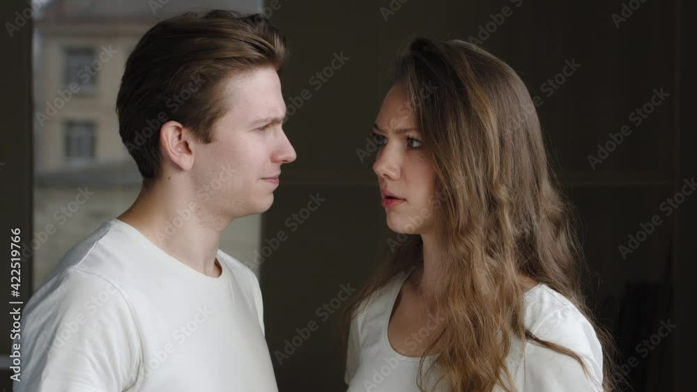 Portrait of surprised couple shocked man and woman, caucasian husband and millennial wife, young guy and girl looking at camera with amazed misunderstanding expression feeling confusion astonishment