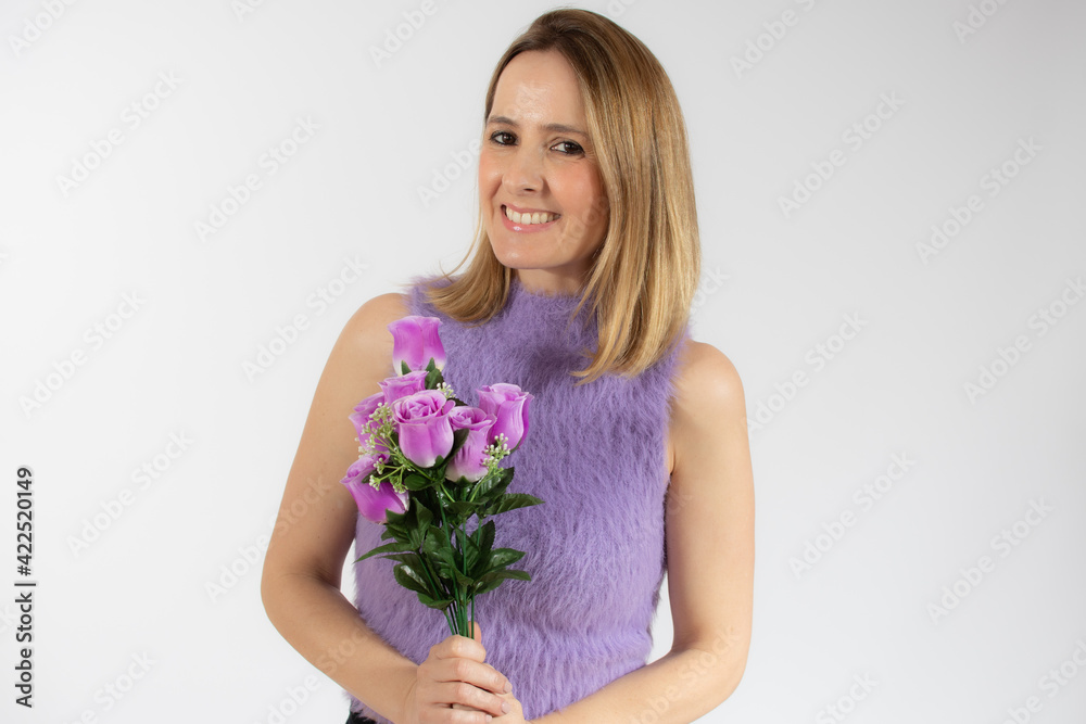 Portrait of a beautiful young woman in casual clothes holding bouquet of flowers isolated over white background Portrait of a beautiful young woman in casual clothes holding bouquet of flowers isolated over white background