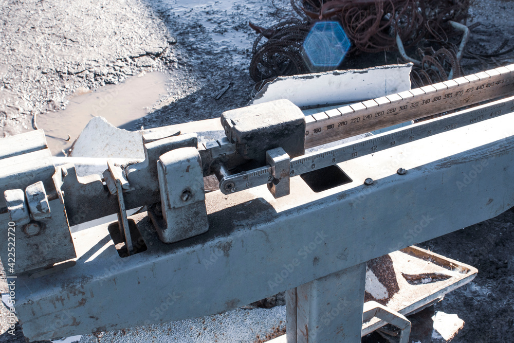 scrap metal collection point with floor scales in early spring during the steel price increase season scrap metal collection point with floor scales in early spring during the steel price increase season