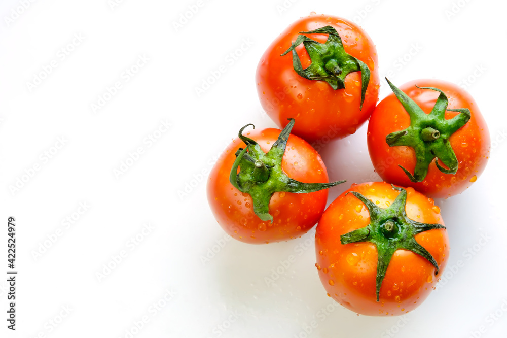Fresh tomatoes on white wooden
table background with copy space with text.Healthy food and nutrition concept. Fresh tomatoes on white wooden
table background with copy space with text.Healthy food and nutrition concept.