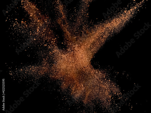 Cocoa explosion on black background