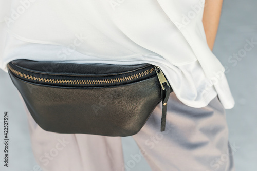 Black Leather Waist Bag For Women Small Leather Bum Bag. Fashionable bag on the girl's belt.