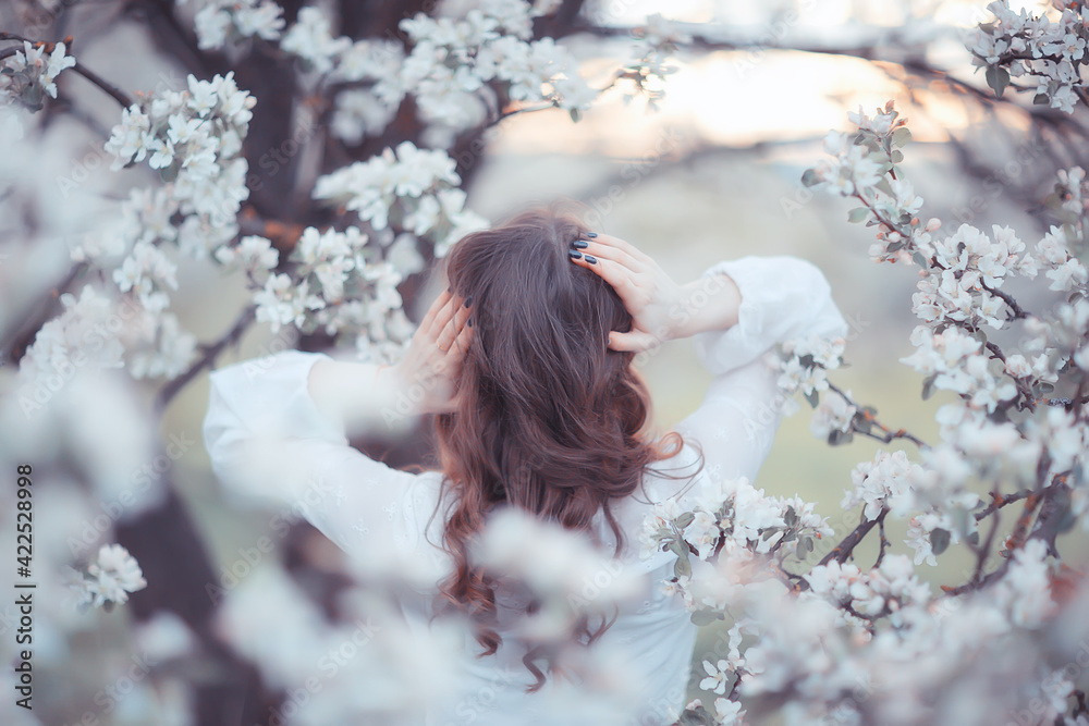 girl dreams back view, spring portrait happy girl in blooming garden, seasonal april girl dreams back view, spring portrait happy girl in blooming garden, seasonal april
