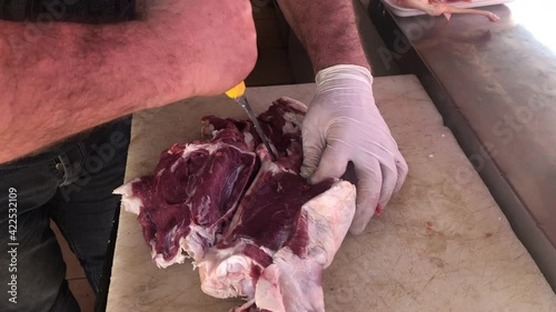 Butcher cutting beef meat, butcher cutting lamb meat in kitchen, Turkish butcher cutting lamb meat