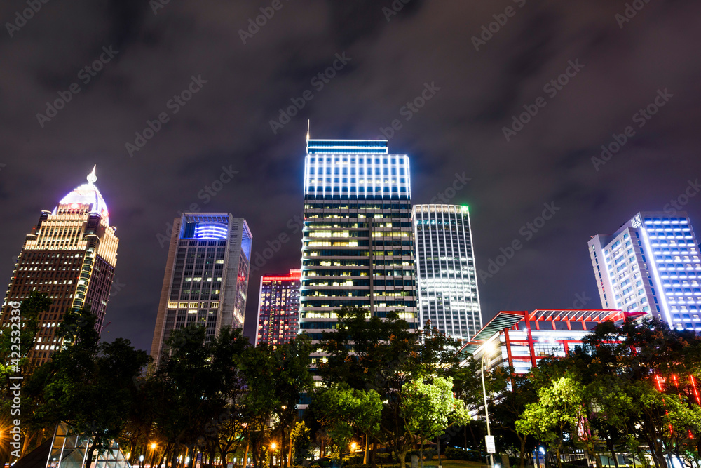 night view of the Xinyi District in Taipei, Taiwan. The district is a prime shopping area in Taipei, anchored by a number of department stores and malls. night view of the Xinyi District in Taipei, Taiwan. The district is a prime shopping area in Taipei, anchored by a number of department stores and malls.