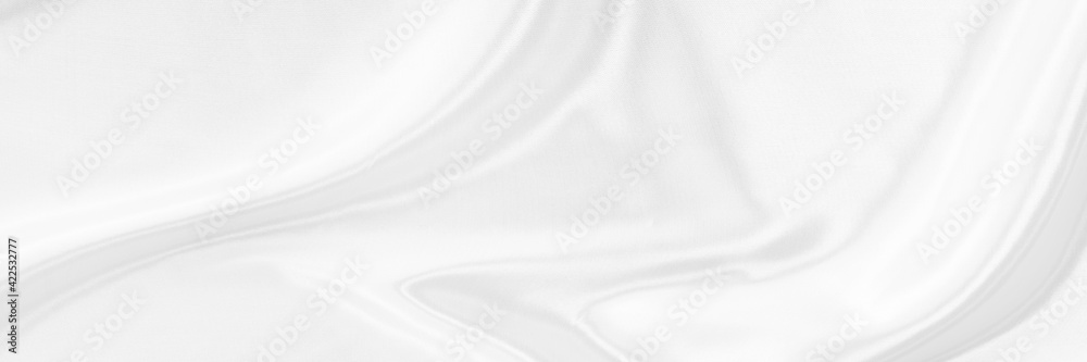 White gray satin texture that is white silver fabric silk background with beautiful soft blur pattern natural.