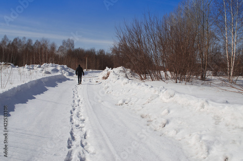 silhouette of a guy on a winter trail