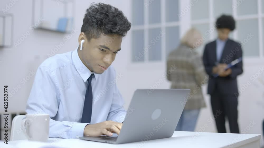 Active office employee playing games on laptop, intern procrastinating at work