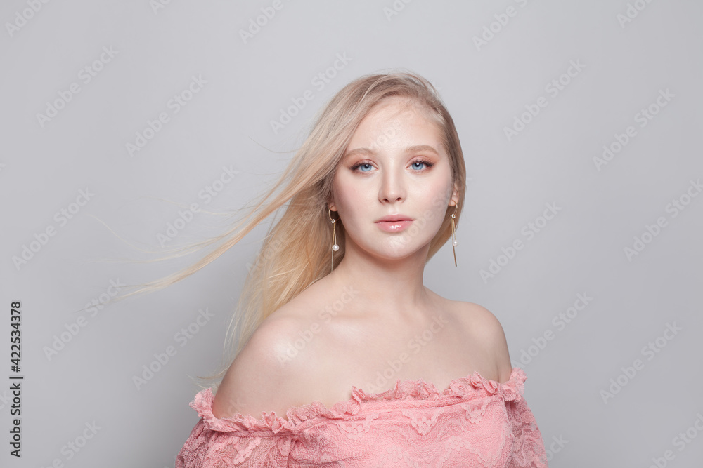 Attractive young woman with blonde hairstyle on white background Attractive young woman with blonde hairstyle on white background