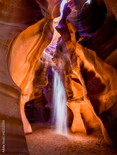 Antelope canyon with dramatic light and colorful canyon walls
