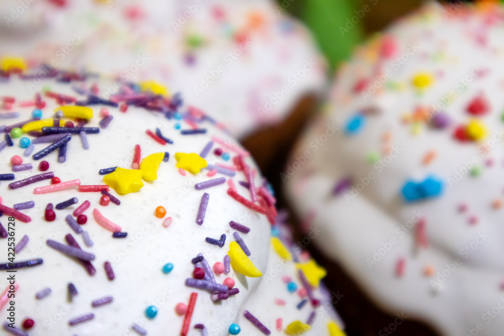 Sugar icing decoration on easter spring holidays sweet bread, paska composition close-up with blurred background. Orthodox traditional handmade kulich with topping Sugar icing decoration on easter spring holidays sweet bread, paska composition close-up with blurred background. Orthodox traditional handmade kulich with topping