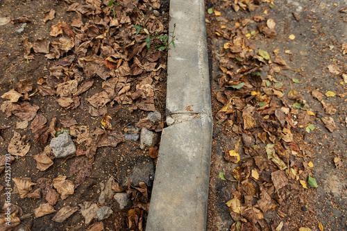 Wallpaper Mural poorly executed road repairs. replacing the old curb stone with a new one Torontodigital.ca