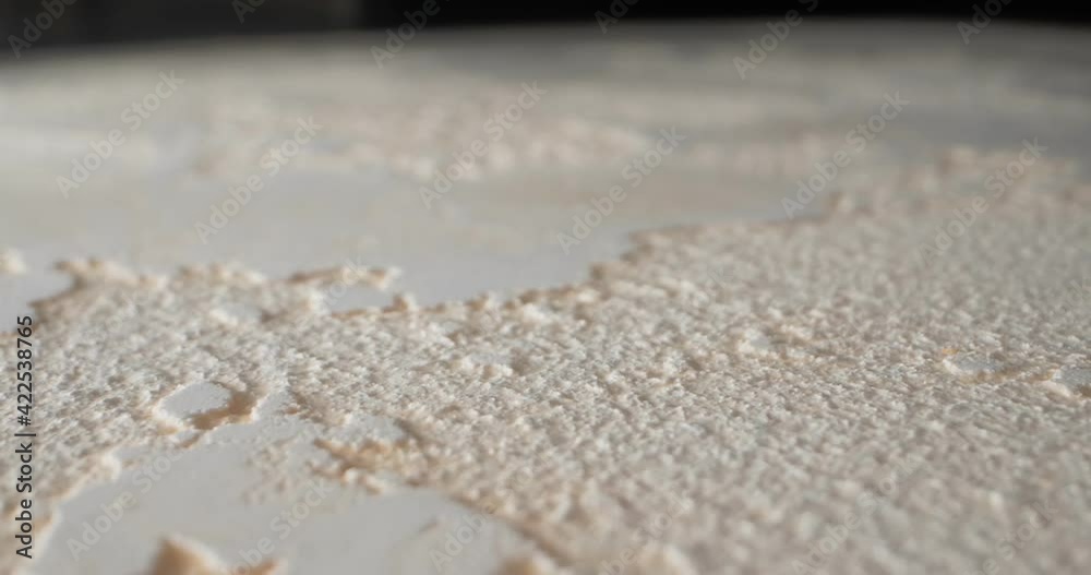 detailed extreme close-up surface finished in beige textured travertini marble.