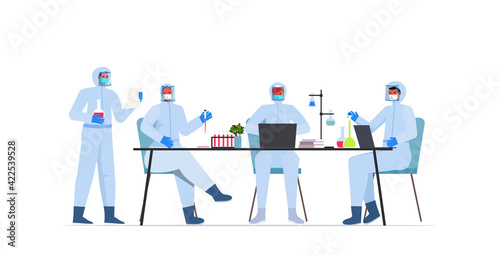 scientists team working together in lab coronavirus vaccine development fight against covid-19 concept