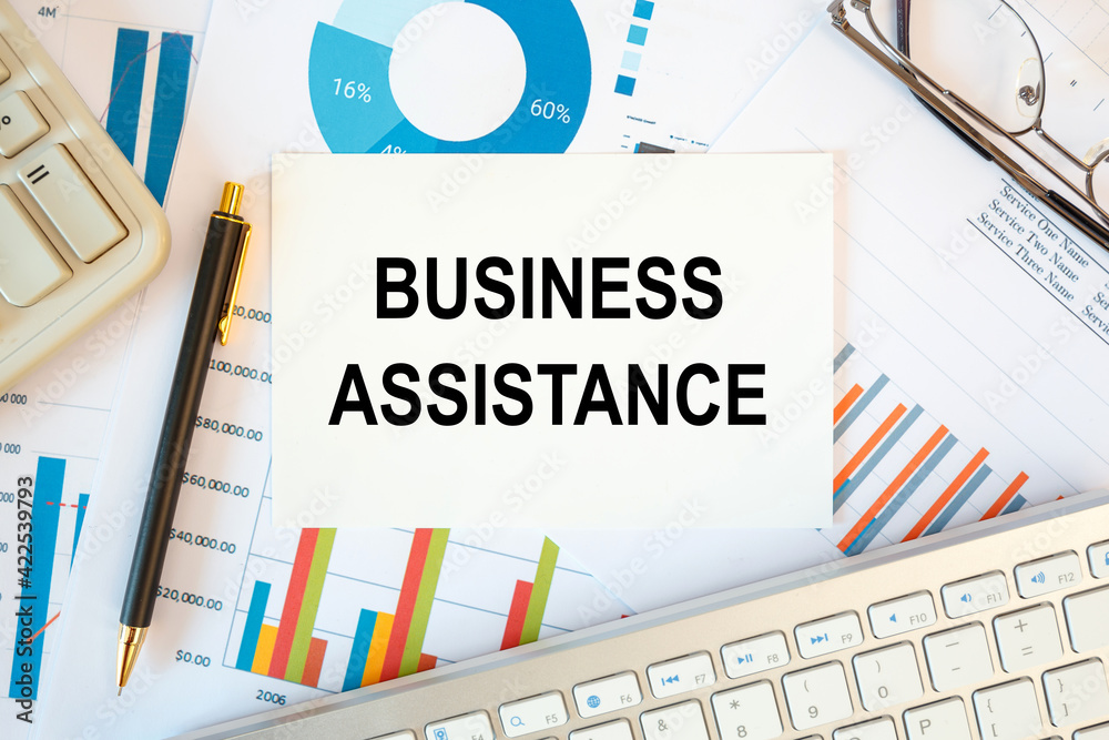 Business Assistance is written in a document on the office desk Business Assistance is written in a document on the office desk