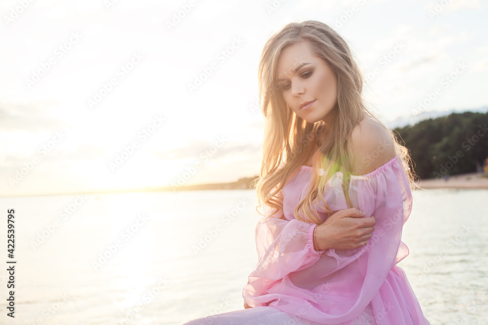 Lovely female model woman in pink dress outdoor