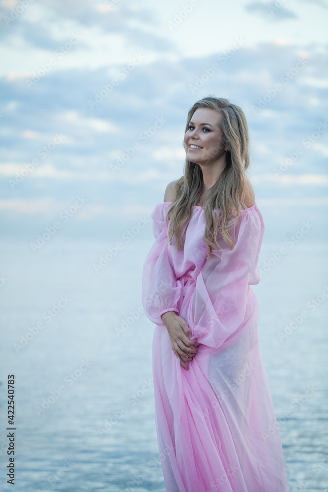Beautiful happy woman in pink dress outdoor Beautiful happy woman in pink dress outdoor