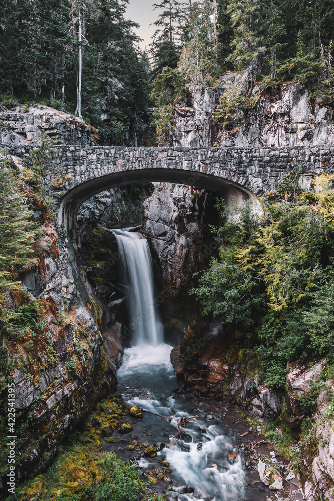 Christine Falls, a waterfall on Van Trump Creek in Pierce County, Washington, best known for the beautifully detailed brick arch of Christine Falls Bridge, Mount Rainier National Park. Christine Falls, a waterfall on Van Trump Creek in Pierce County, Washington, best known for the beautifully detailed brick arch of Christine Falls Bridge, Mount Rainier National Park.