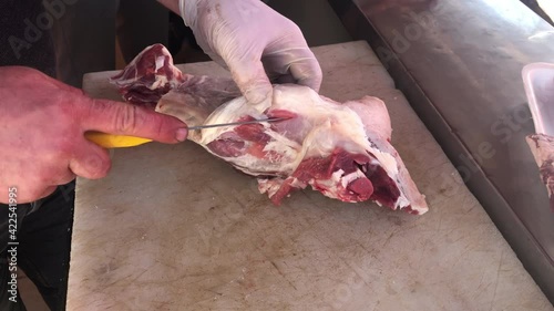 Butcher cutting beef meat, butcher cutting lamb meat in kitchen, Turkish butcher cutting lamb meat
