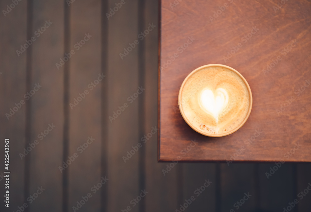 Takeaway cup of tasty latte on table outdoors Takeaway cup of tasty latte on table outdoors