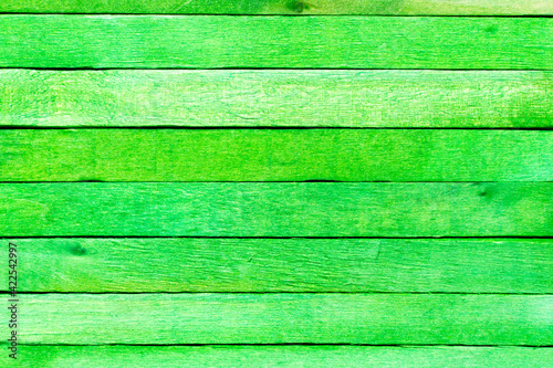 Green color wood plank use as textured background, frame, decoration with copy space