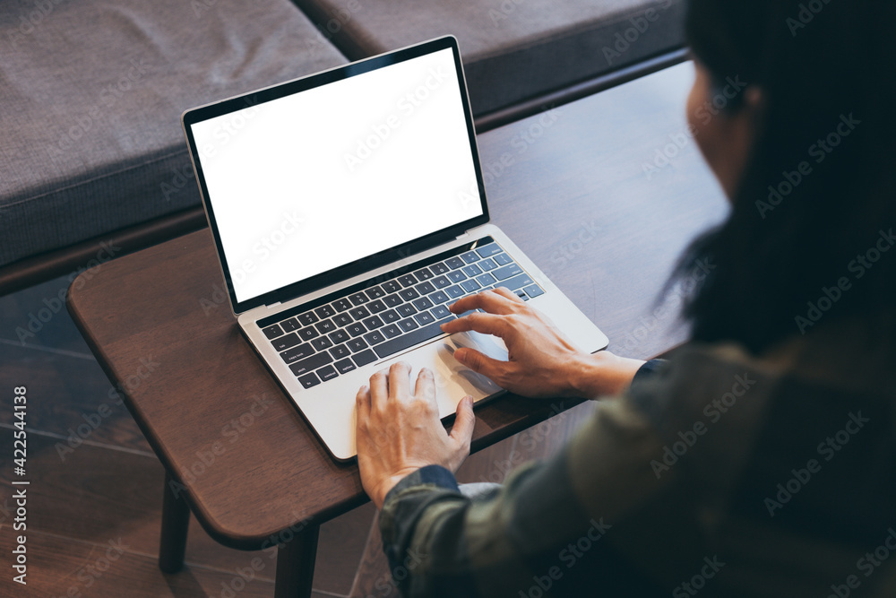 computer screen blank mockup.hand woman work using laptop with white background for advertising,contact business search information on desk at coffee shop.marketing and creative design computer screen blank mockup.hand woman work using laptop with white background for advertising,contact business search information on desk at coffee shop.marketing and creative design