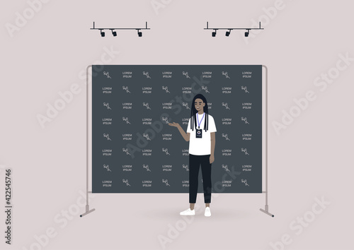 A young female Black character standing in front of a black press wall background covered with a logo pattern, a press conference event