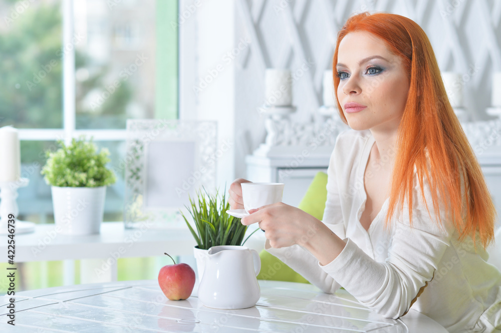 young beautiful woman drinking coffee at home young beautiful woman drinking coffee at home