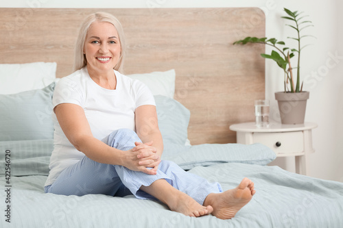 Smiling mature woman sittin...
