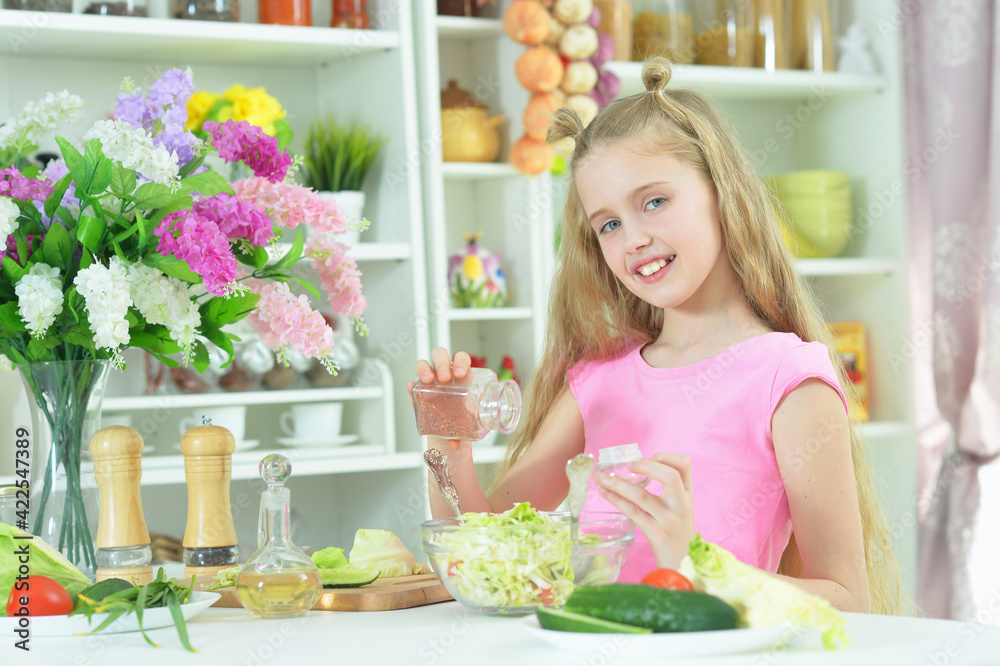 Cute girl preparing delicious fresh salad Cute girl preparing delicious fresh salad