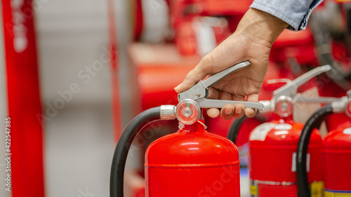 Tableau sur toile Engineer inspection Fire extinguisher and fire hose,Ready to use in the event of a fire