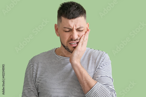 Man suffering from tooth ac...