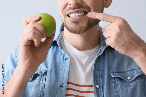 Man with aching teeth and a...