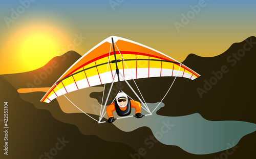 Man having fun on hang gliding extreme sport. Cheerful hang gliding tandem flying in sky
