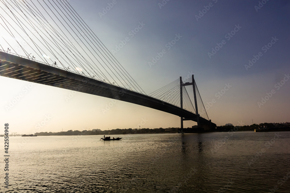 Silhouette of the iconic Howrah bridge over the Hooghly river in the city of Kolkata. Silhouette of the iconic Howrah bridge over the Hooghly river in the city of Kolkata.