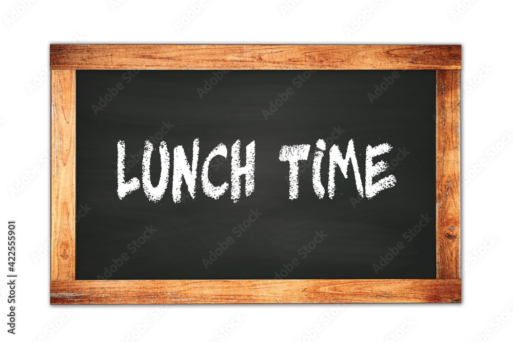 LUNCH TIME text written on wooden frame school blackboard. LUNCH TIME text written on wooden frame school blackboard.
