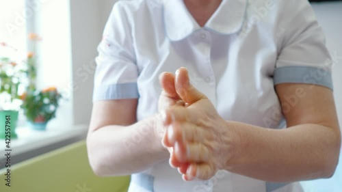 Wallpaper Mural Nurse rubs her hands with oil before massage Torontodigital.ca