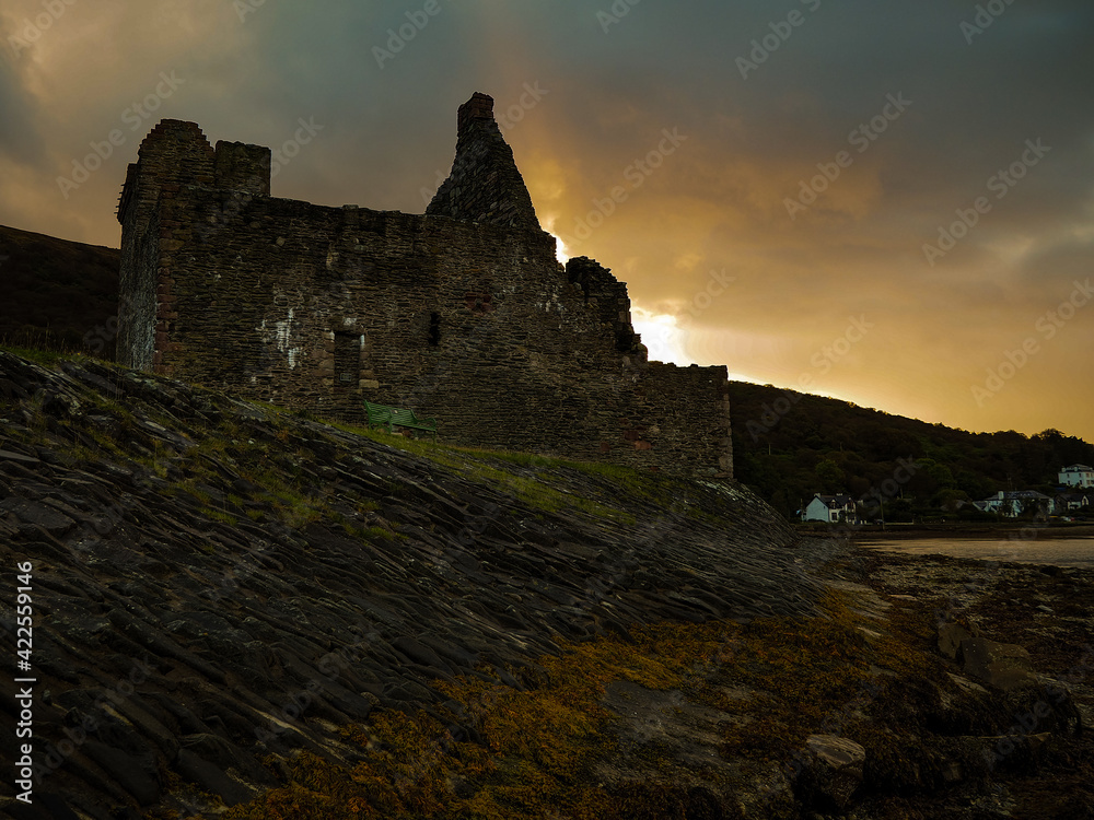 A dilapidated castle one of many in Scotland shot as the sun sets on the coastline