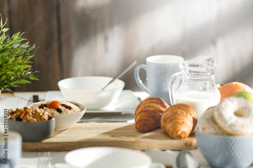 Spring breakfast on a wooden table in a mountain hut in the morning 