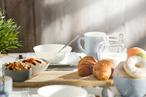 Spring breakfast on a wooden table in a mountain hut in the morning 
