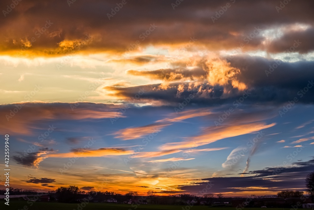 sunset in rural areas, bright sky with clouds . dramatic sky