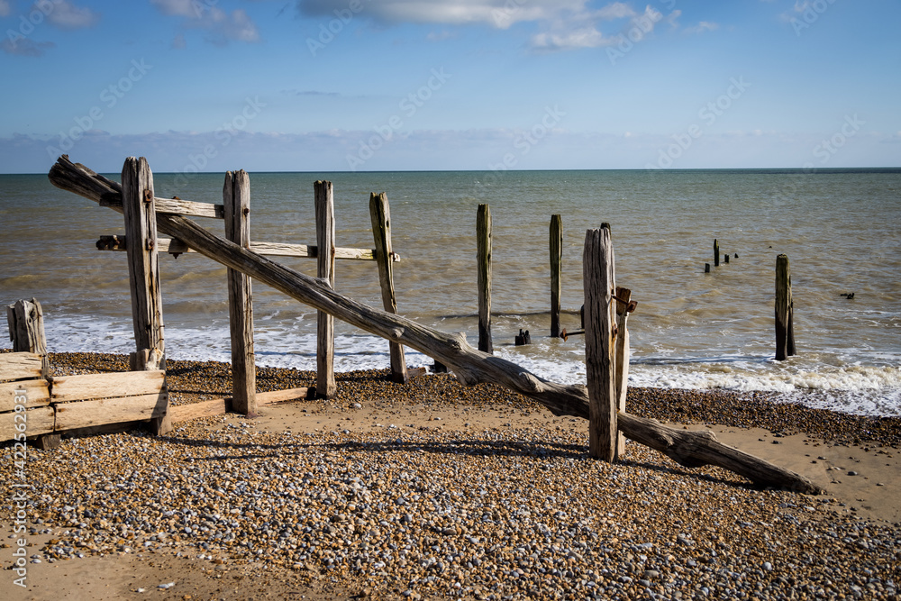 Old wooden groynes at Rye Harbour, East Sussex, England Old wooden groynes at Rye Harbour, East Sussex, England
