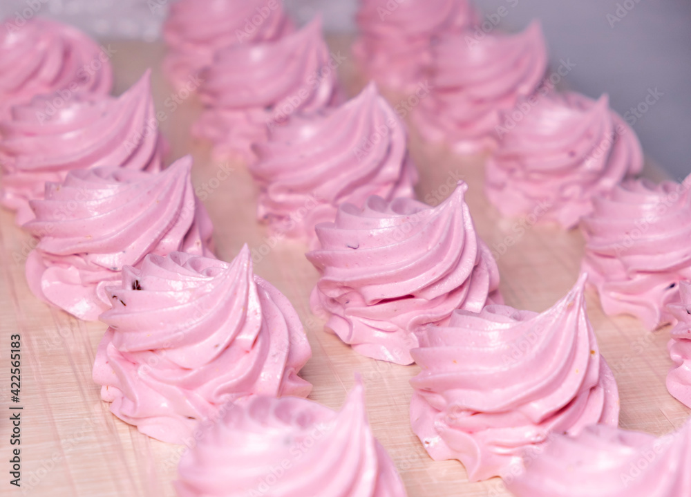Handmade pink marshmallows on parchment background. Marshmallow, Meringue. Homemade Sweets dessert