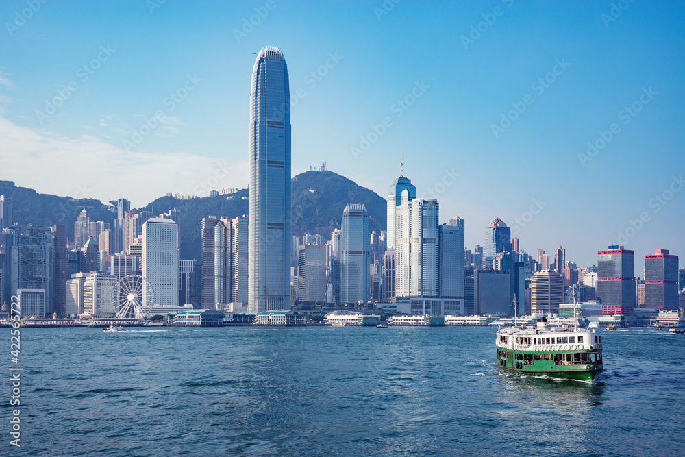 Passenger ship on Hong Kong island background.