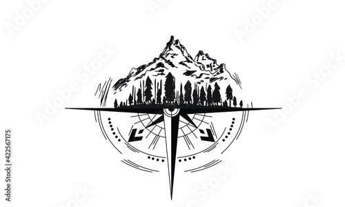 Compass and outline of mountains and forest