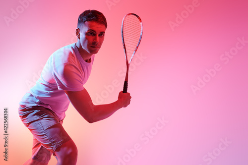 sporty guy playing squash © Andrey Kiselev