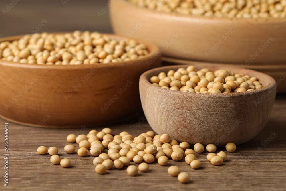 Natural organic soy beans on wooden table Natural organic soy beans on wooden table