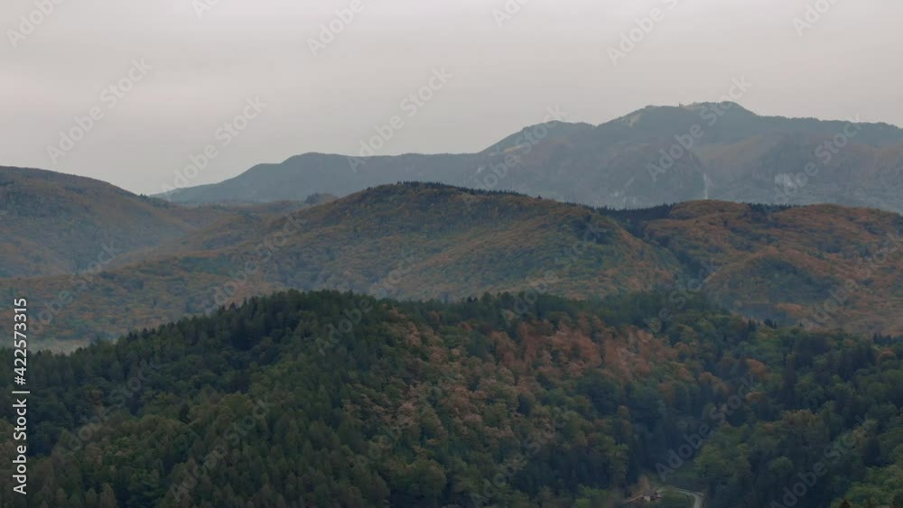 Aerial drove panoramic horizon view of a beautiful mountain hill at sunset Aerial drove panoramic horizon view of a beautiful mountain hill at sunset
